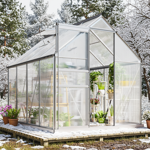 Greenhouse with plants in a snowy landscape